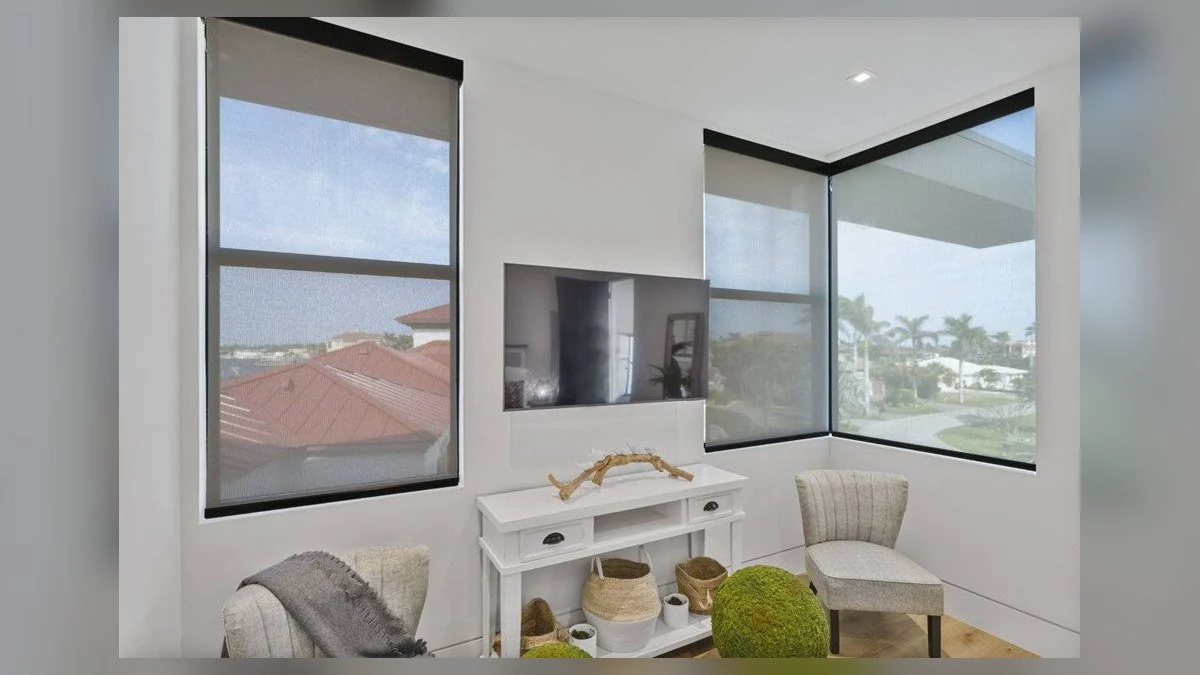 Interior solar shades lowered across broad windows