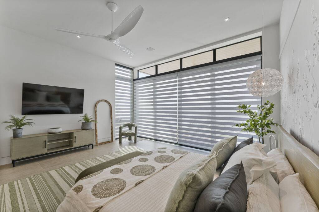 A Modern Bedroom After Construction Showcasing A Clean And Finished Look With Zebra Blinds That Enhance Light Control And Privacy