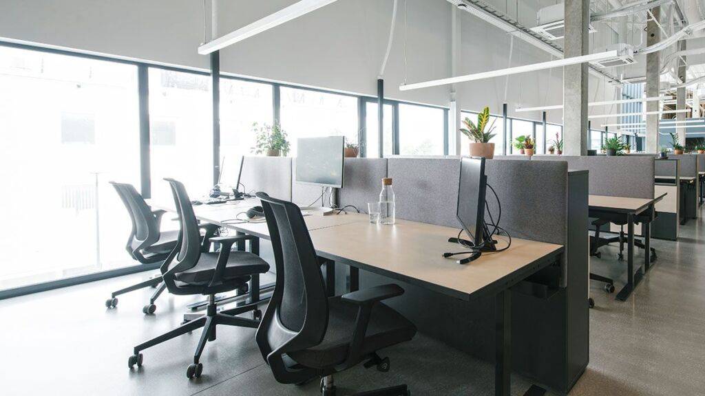 Blackout smart roller blinds on large windows of Babcock Ranch office