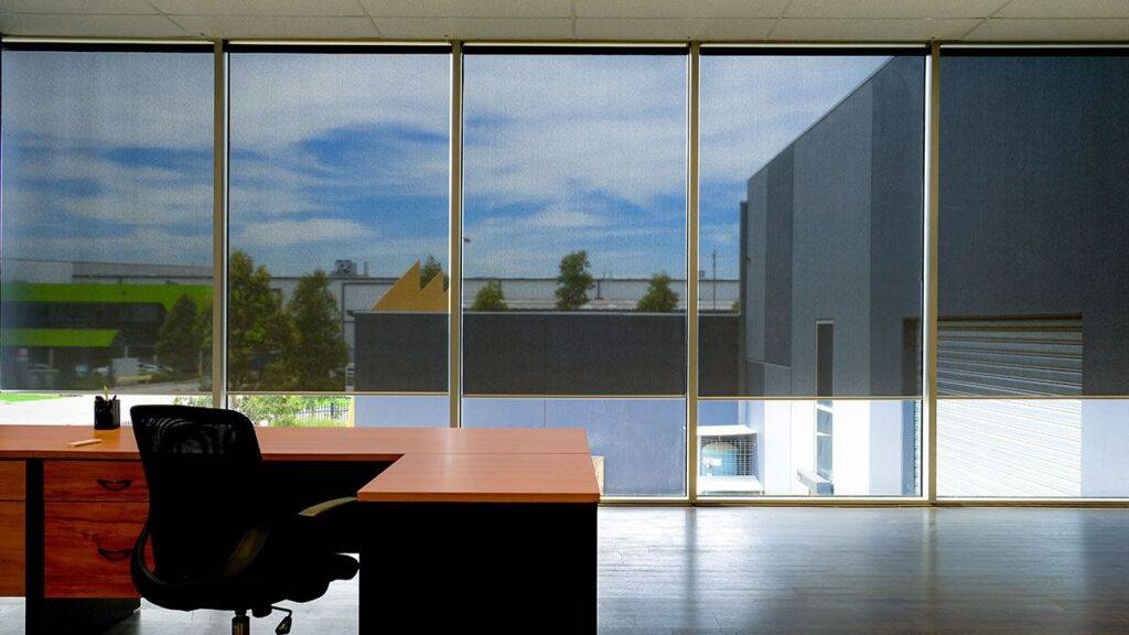Blackout smart roller blinds on large windows of Babcock Ranch office