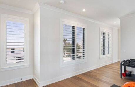 Custom plantation shutters installed by EV Blinds in a Southwest Florida living area