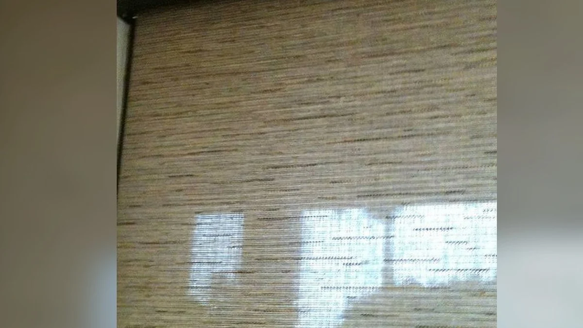 Close detail of woven shade fibers and filtered daylight