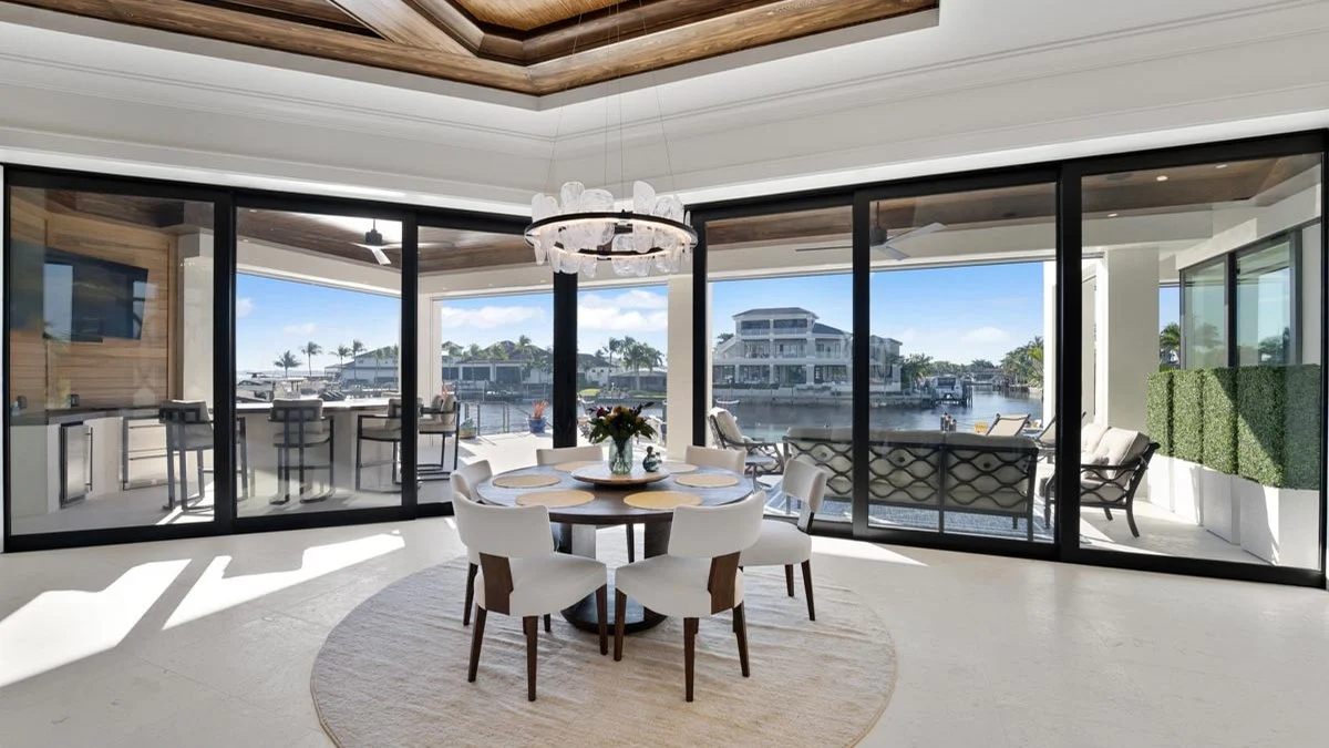 Wide glass and waterfront views in a Cape Coral dining area