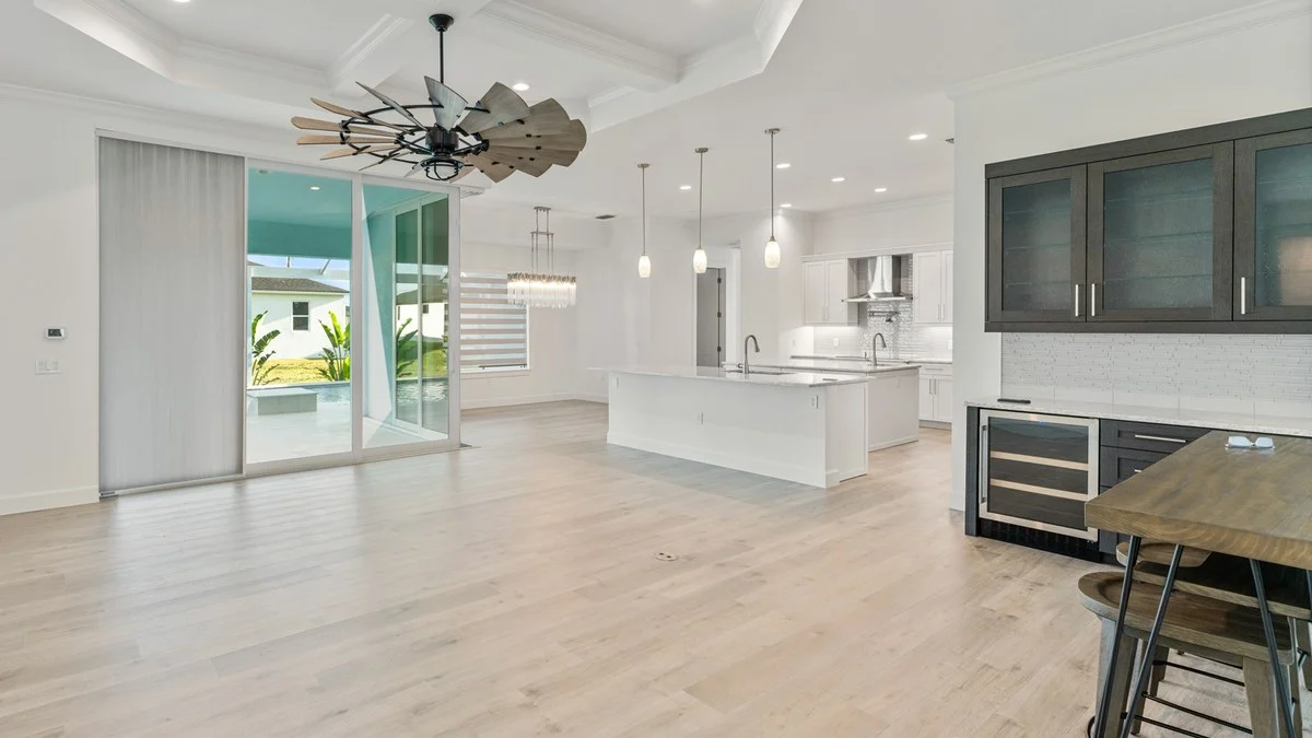 Sheer slider shades paired with zebra shades in a Cape Coral home