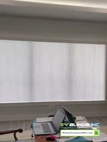 Honeycomb shades above a home-office desk