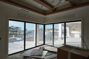 Custom motorized blinds installing in a SWFL bedroom