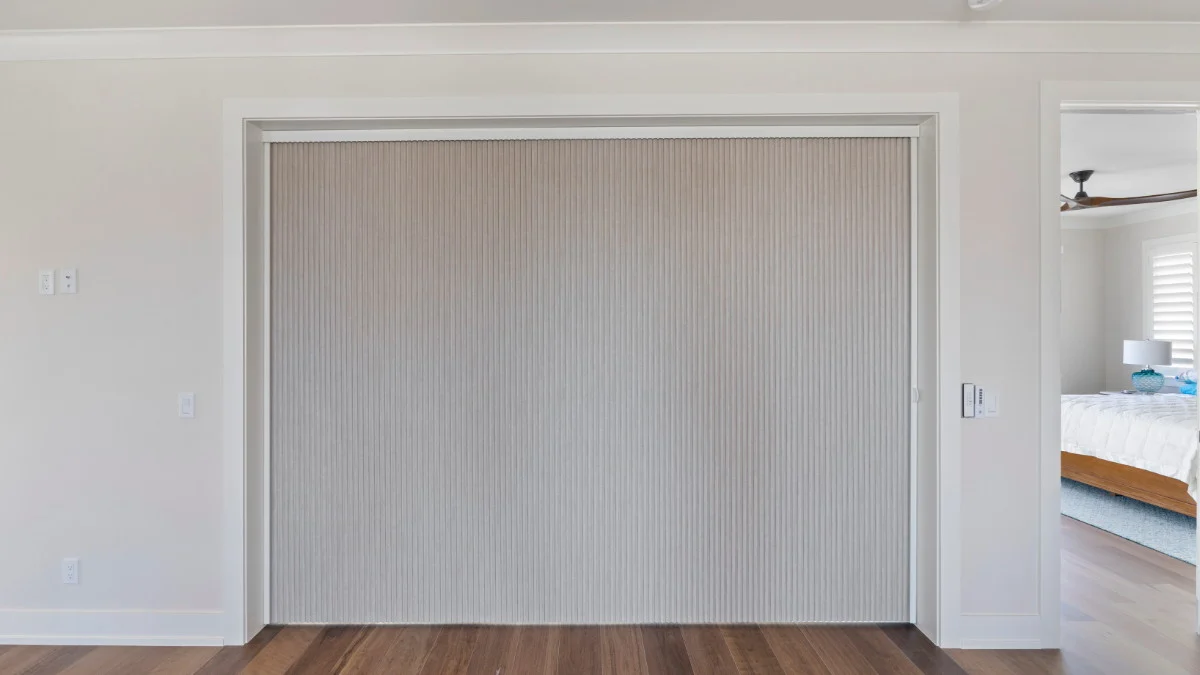 Room-darkening shades fitted across a Fort Myers Beach slider