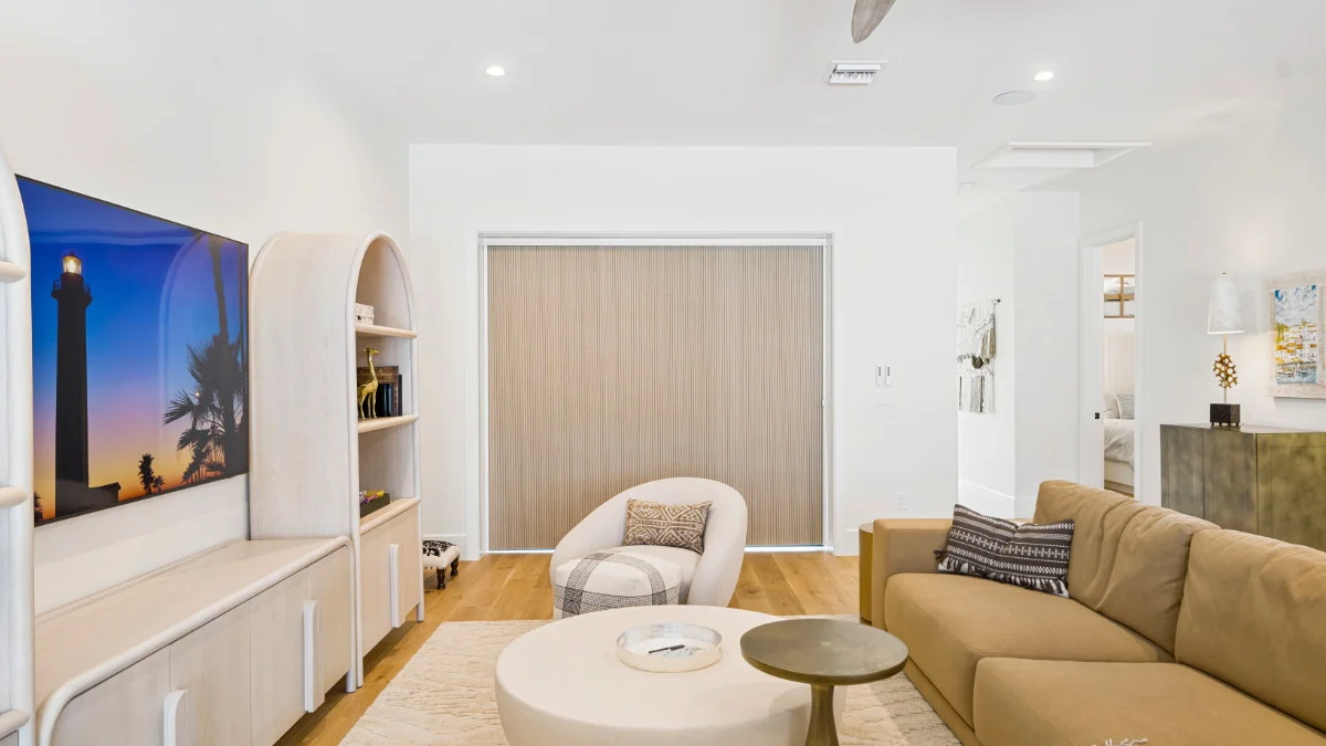 Blackout cellular shades adjusted for a coastal bedroom