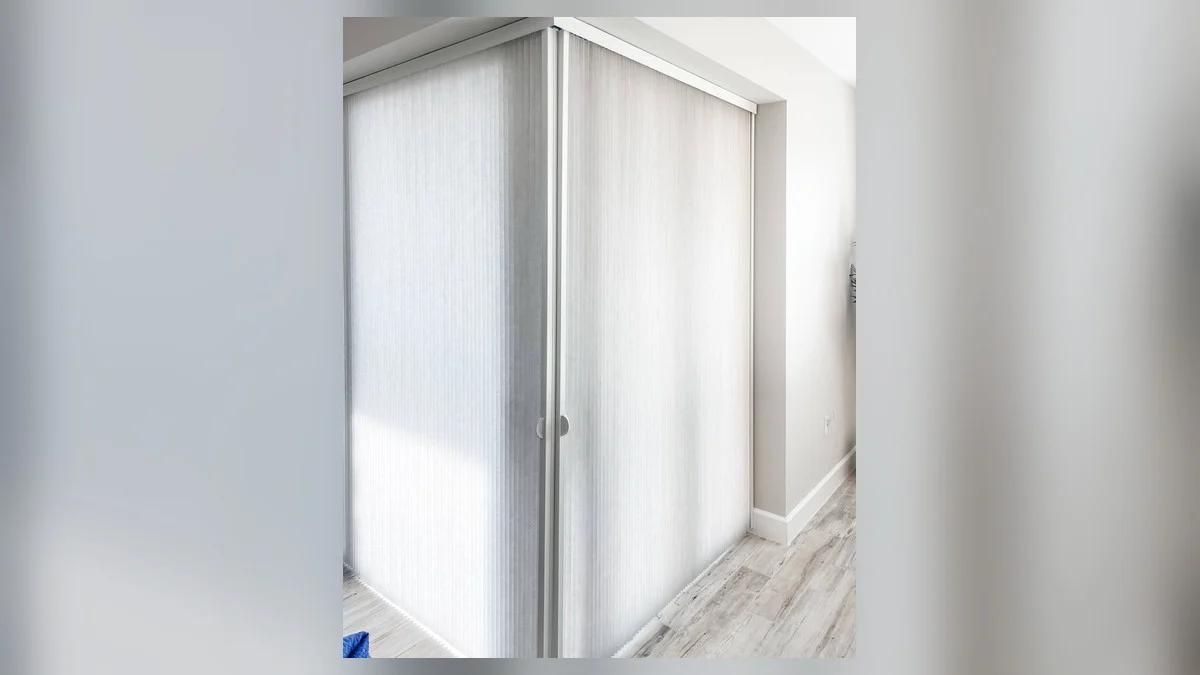 Vertical blind vanes and track for a Fort Myers Beach opening