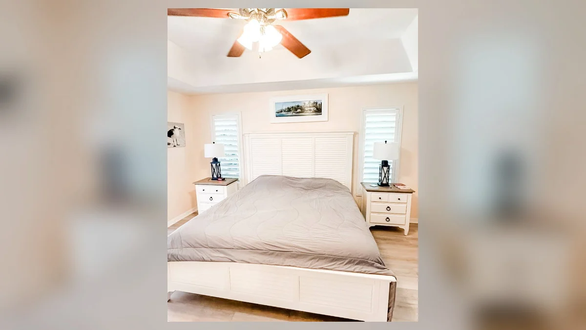 Natural wood shades adding texture to a coastal bedroom
