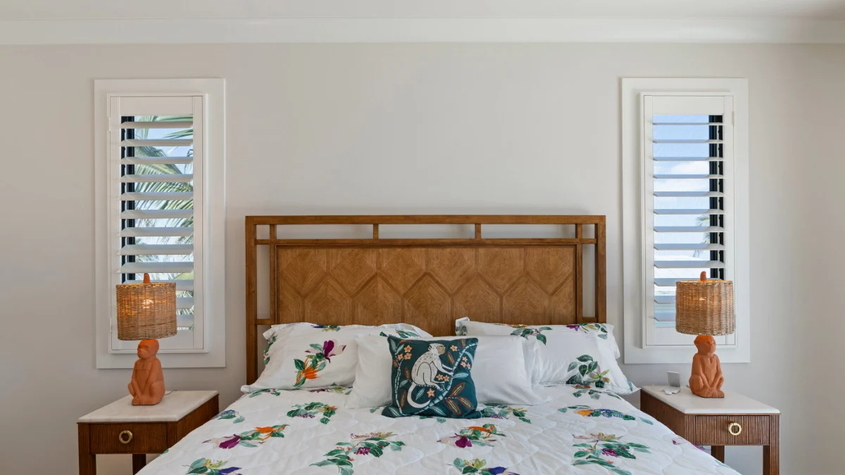 Natural-tone window treatment inspiration for a coastal bathroom