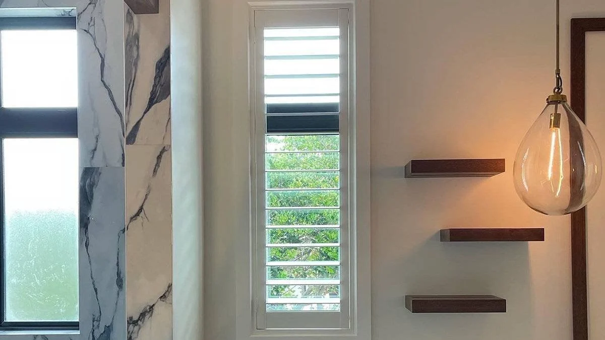 Custom horizontal blinds tilted for privacy and daylight