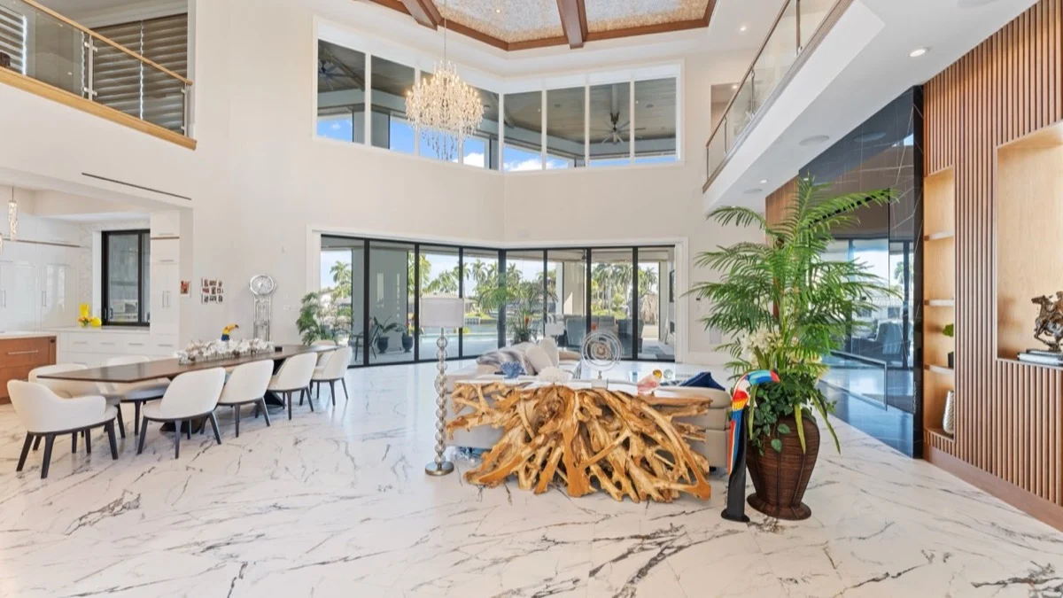 Oversized sliding glass doors open to the view after HoneycombSpan shades retract
