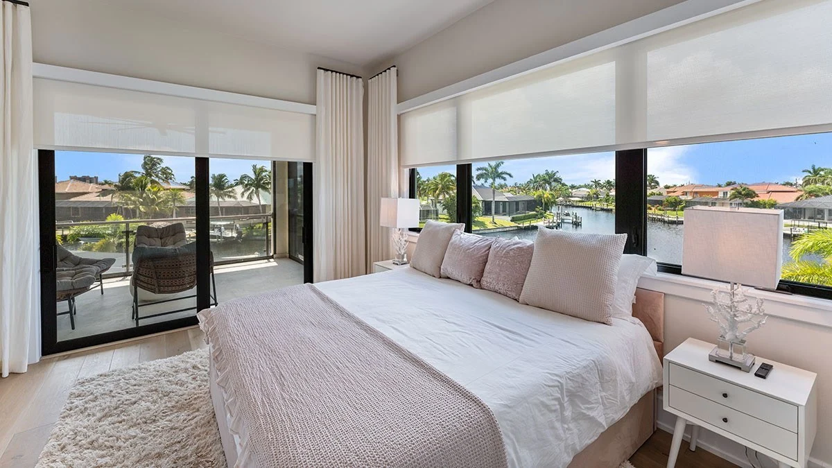 Powered roller shades providing convenient control across broad glass