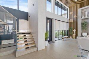 Motorized roller shades on large window treatments by EV Blinds