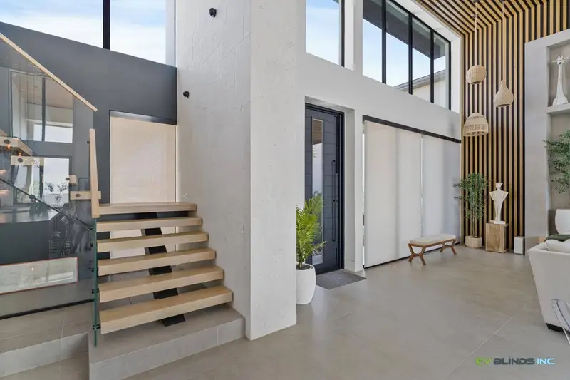 Motorized roller shades on large window treatments by EV Blinds