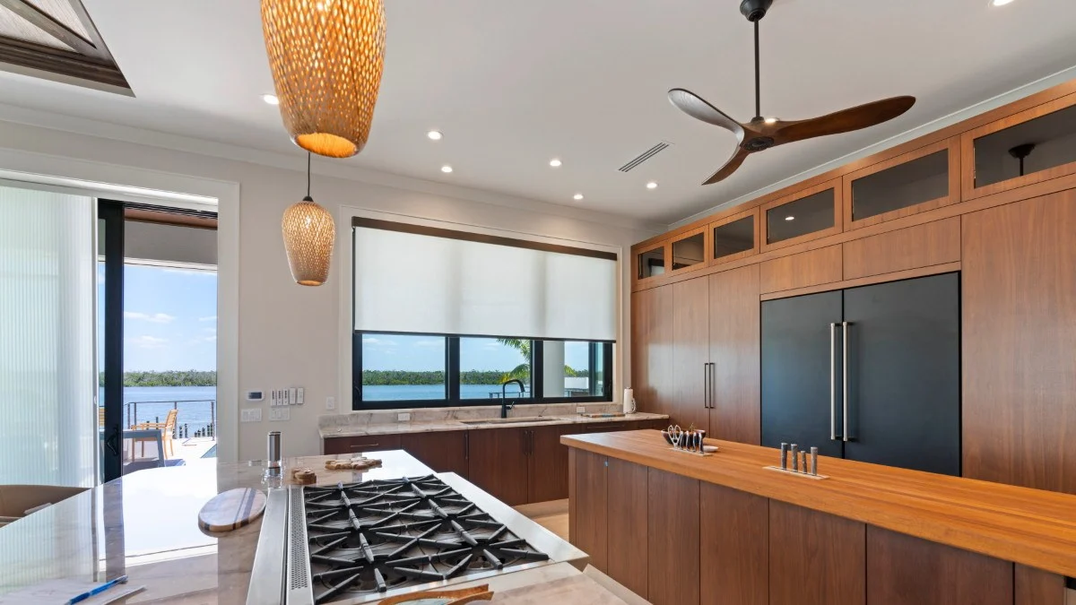 Custom roller shade filtering daylight across a wide window