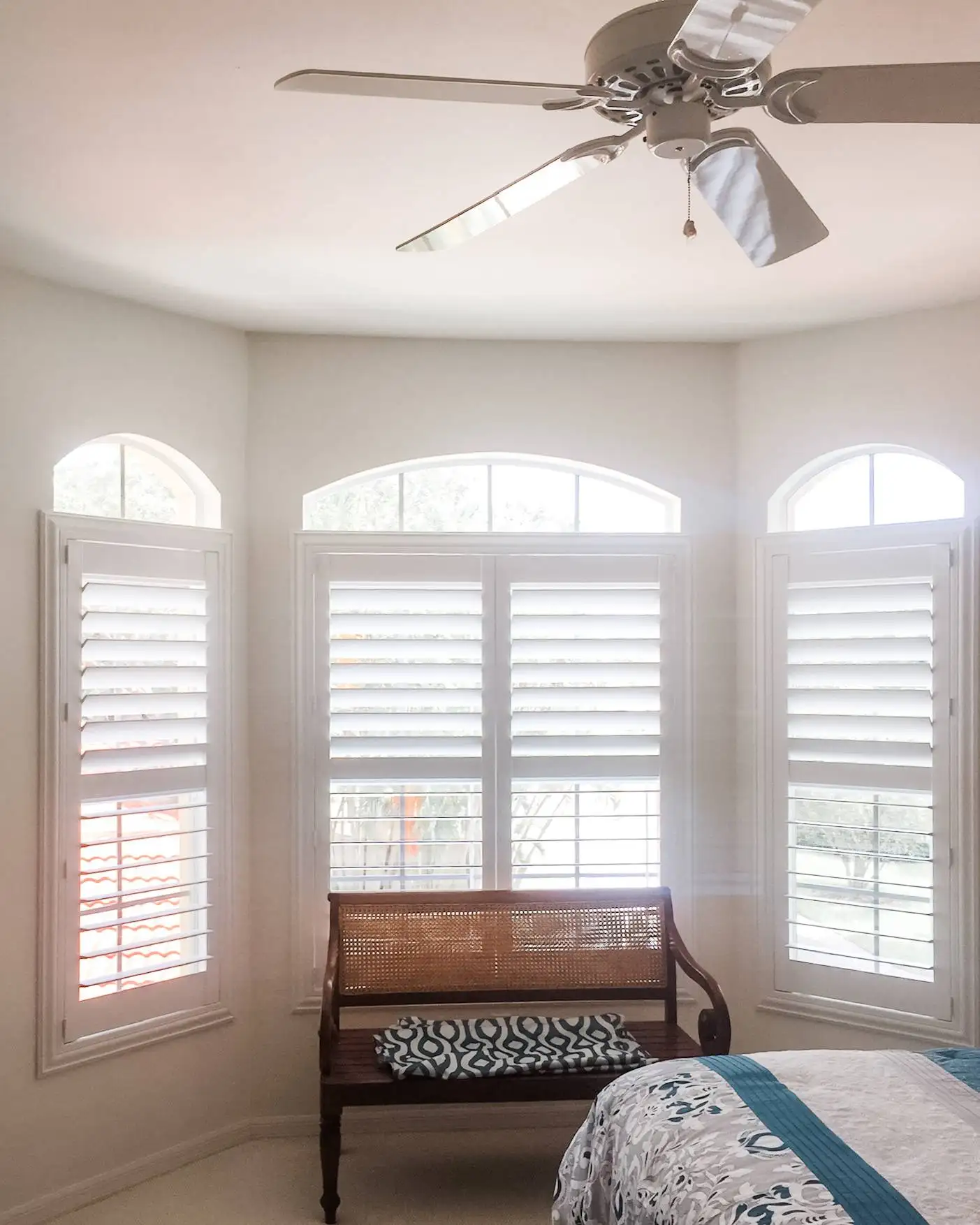 Plantation Shutters for arched windows in bedrooms in Naples