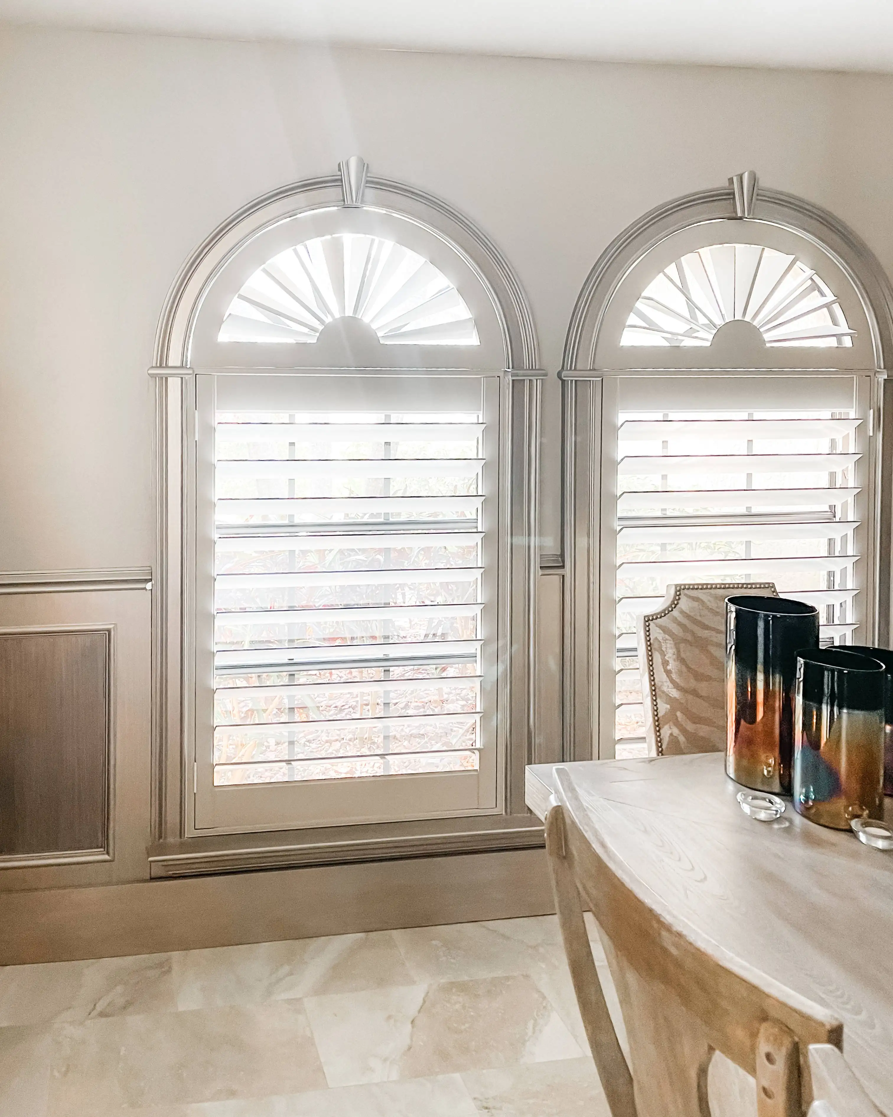 Plantation Shutters for arched windows in dining room in Naples