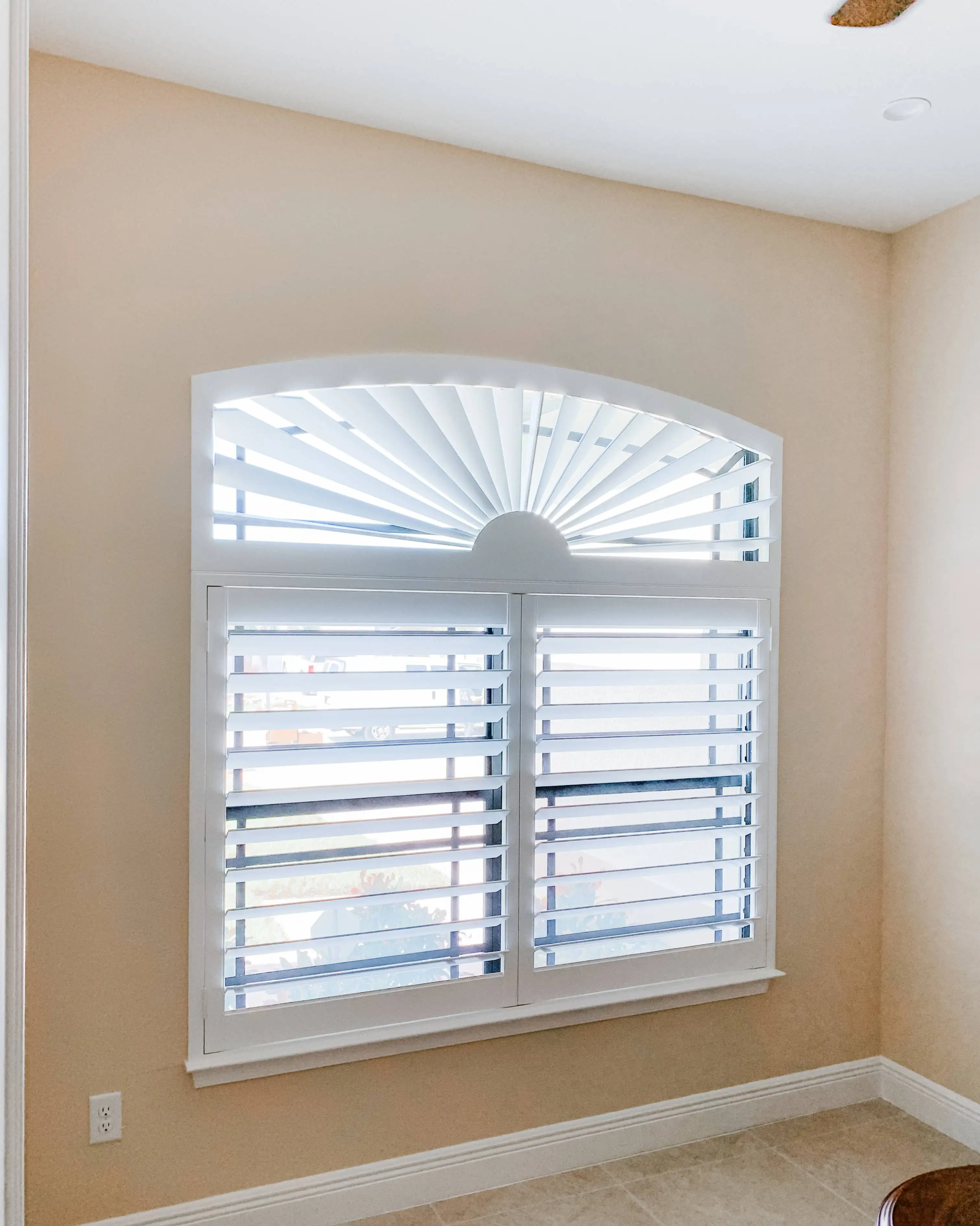 Plantation Shutters for arched windows in hallways in Marco Island