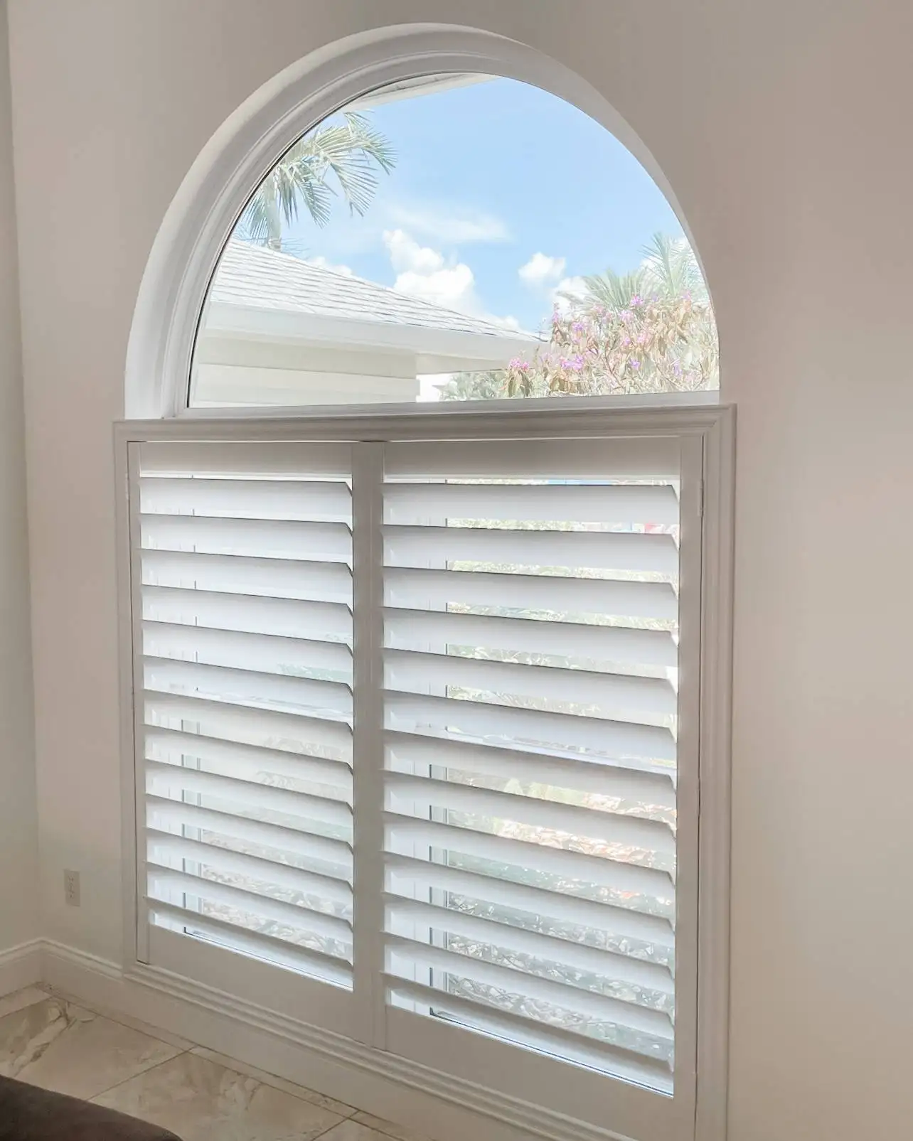 Plantation Shutters for arched windows in hallways in Naples