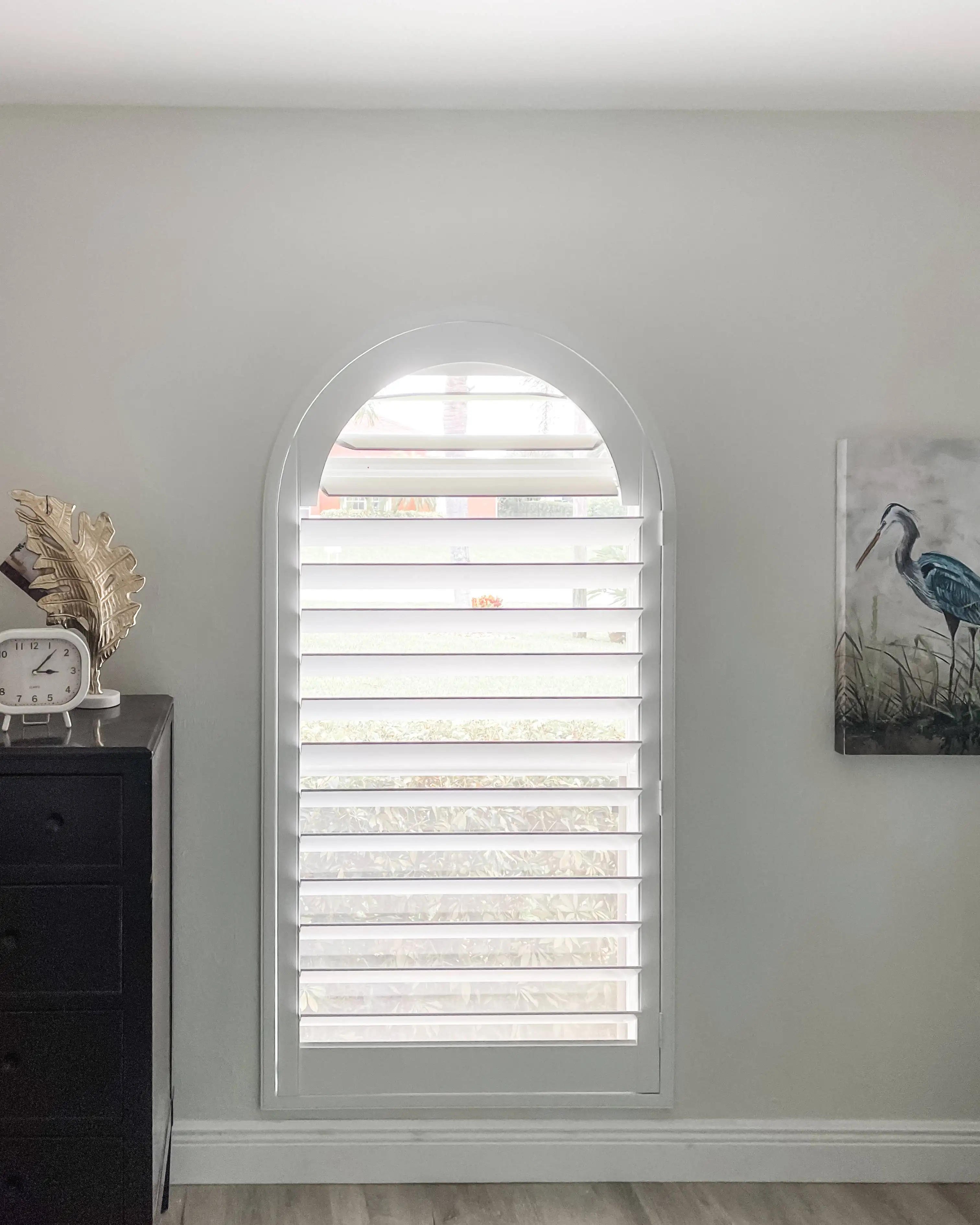 Plantation Shutters for arched windows in hallways in North Naples