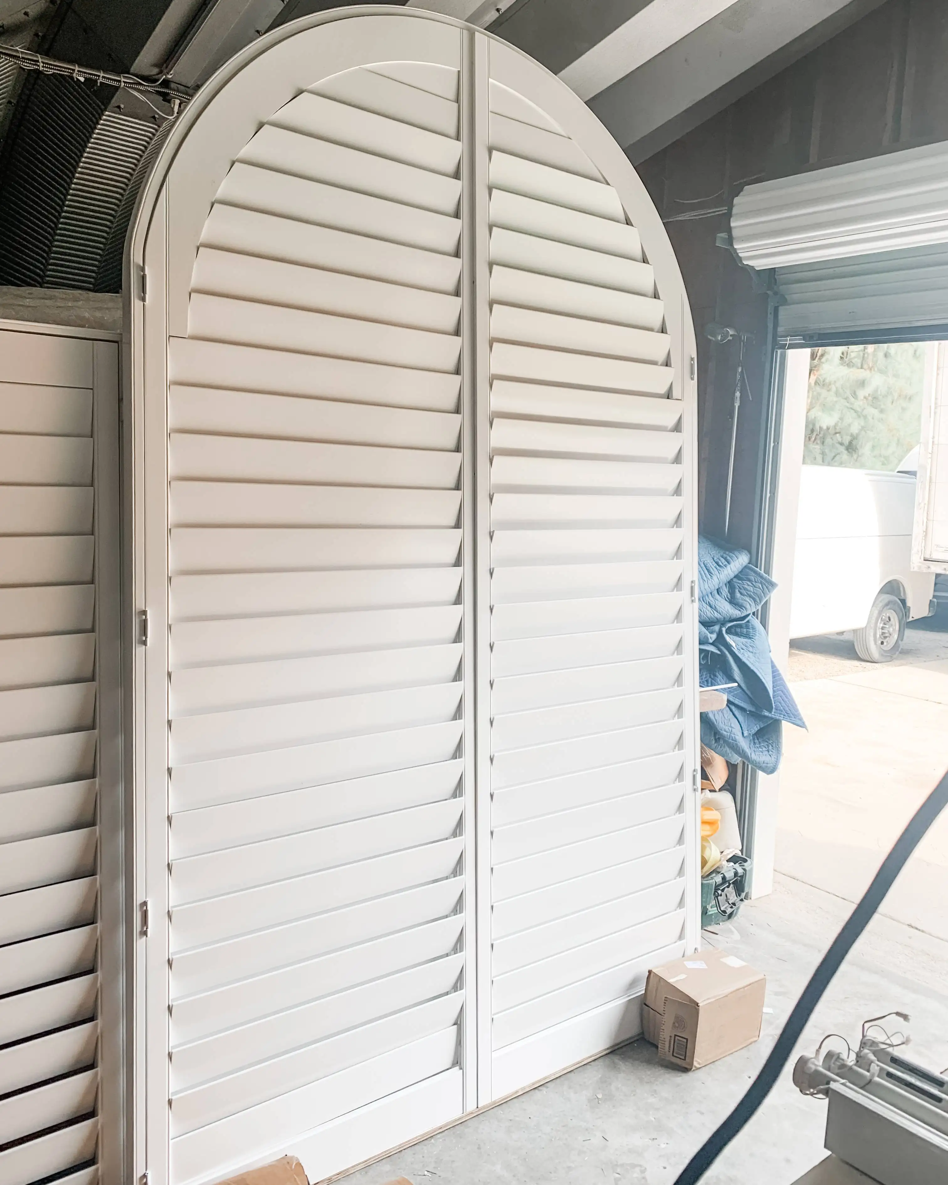 Plantation Shutters for arched windows in living room in backcock ranch