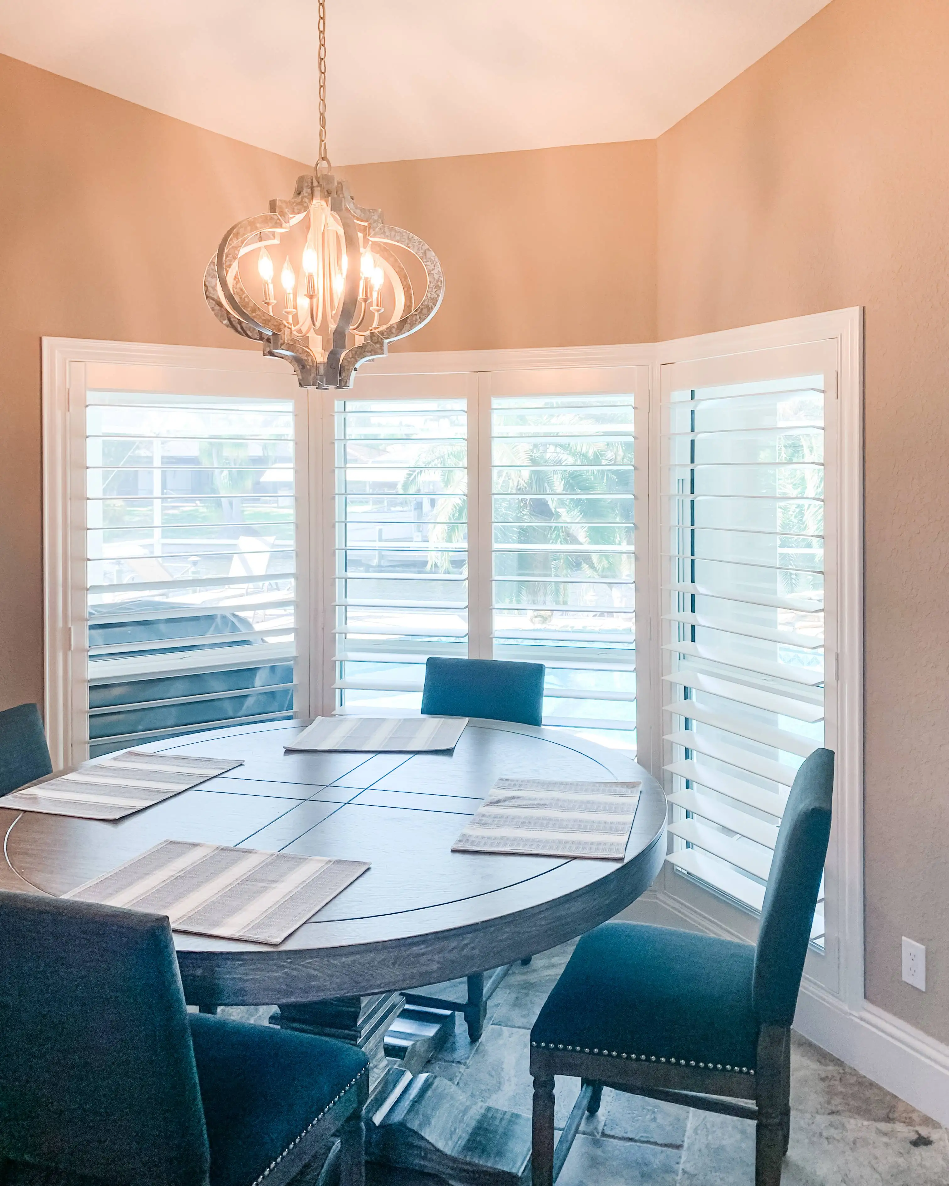 Plantation Shutters for bay windows in dining room in Marco Island