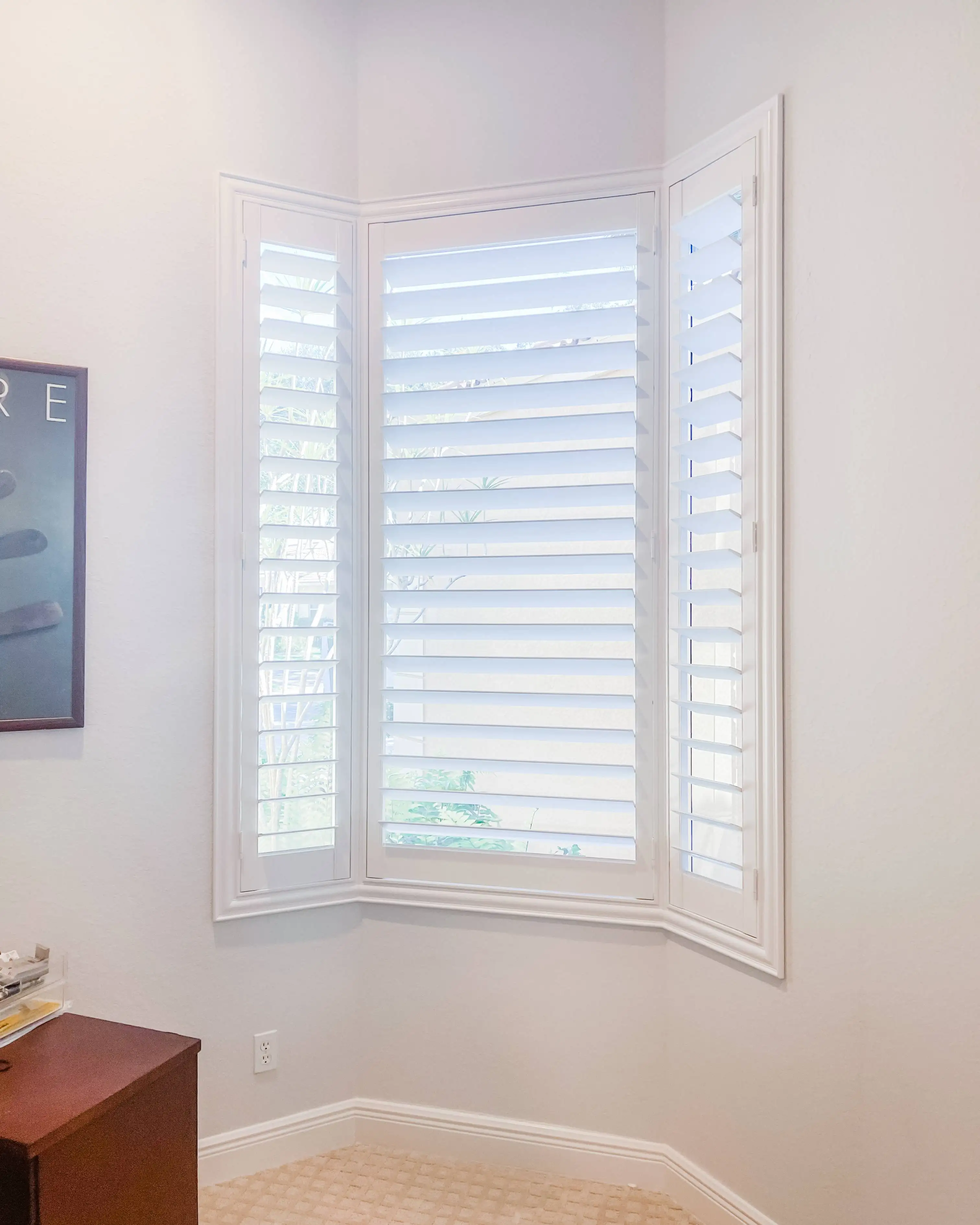 Plantation Shutters for bay windows in home office in Naples