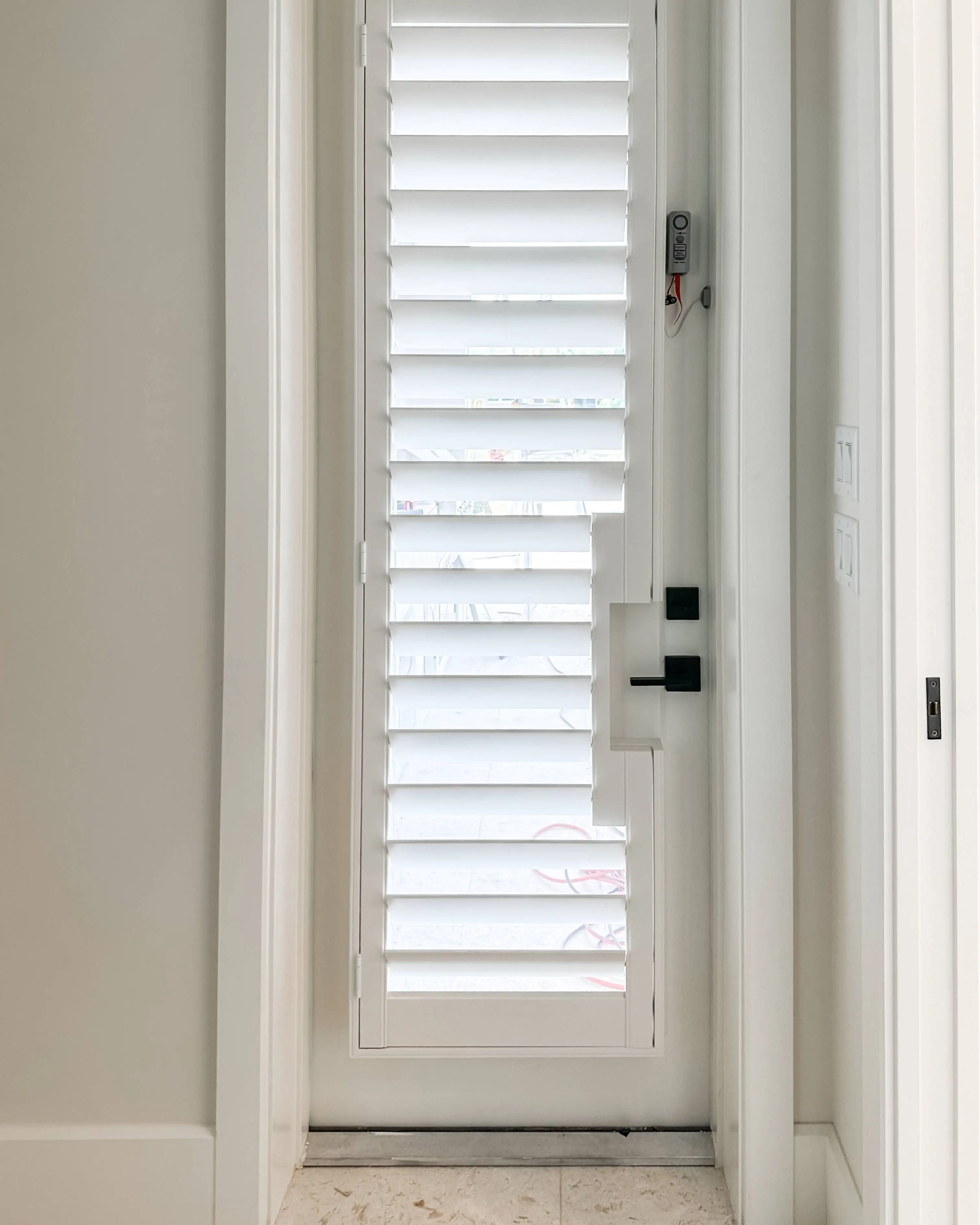 Plantation Shutters for door blinds in hallway in Fort Myers