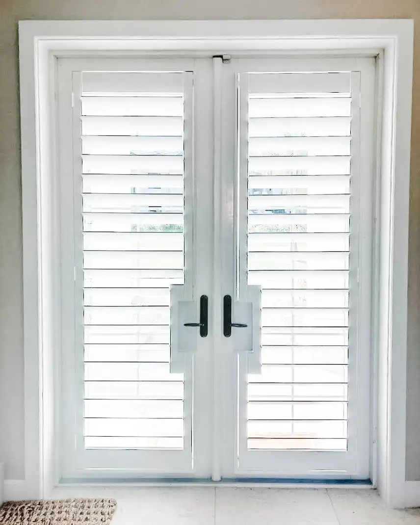 Plantation Shutters for door blinds in living room in Marco Island