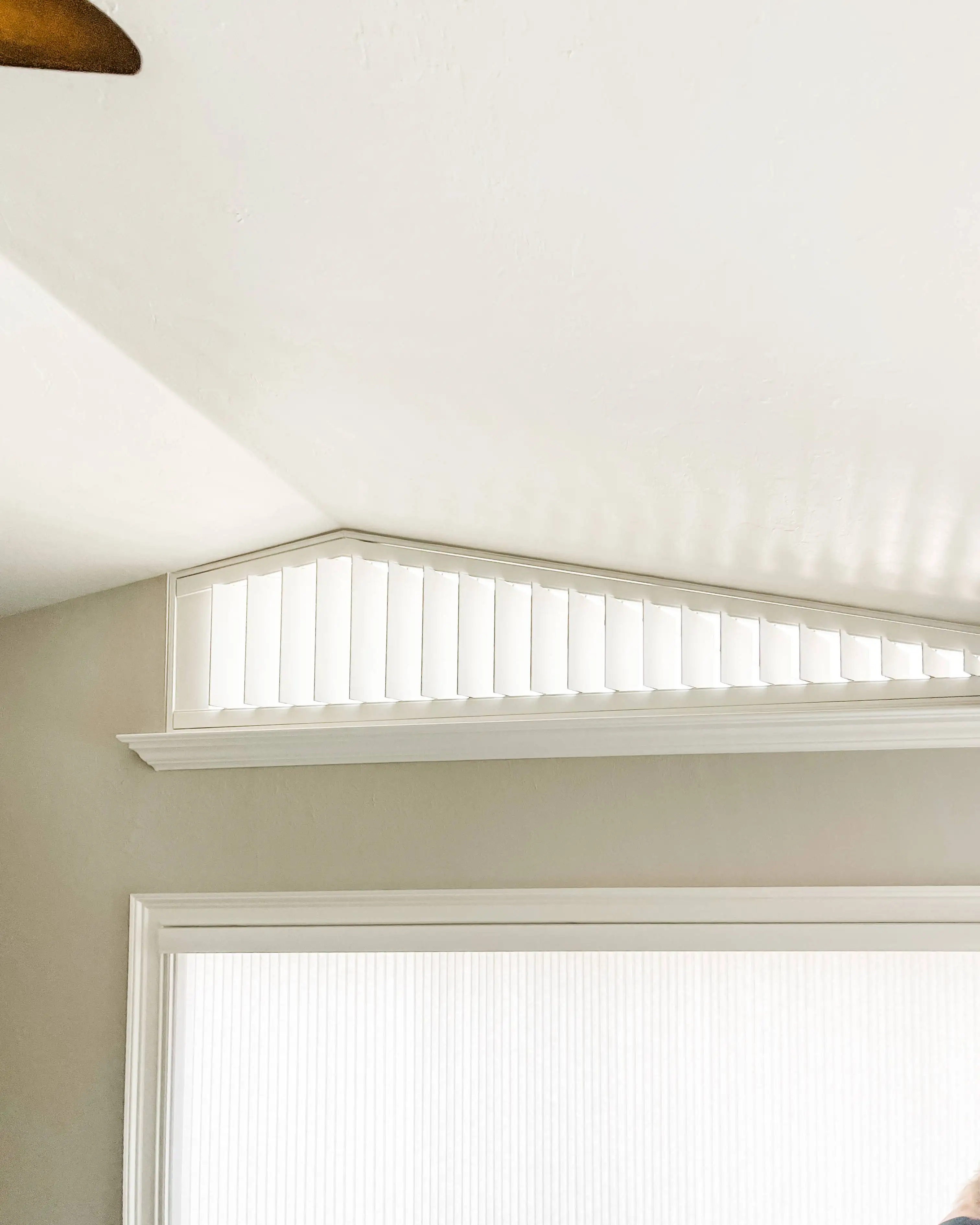 Plantation Shutters for arched window in living room in Naples High Rise