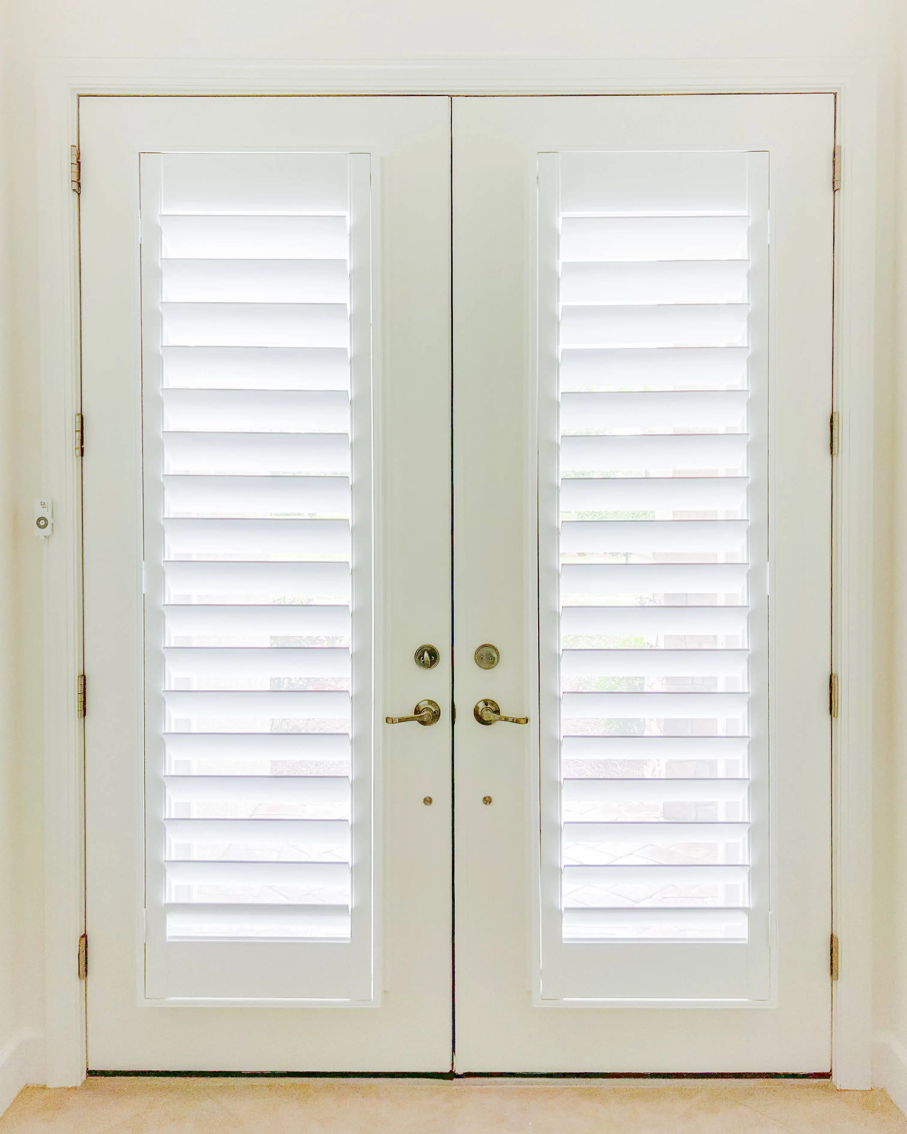 Plantation Shutters for door blinds in hallways in Pelican Bay