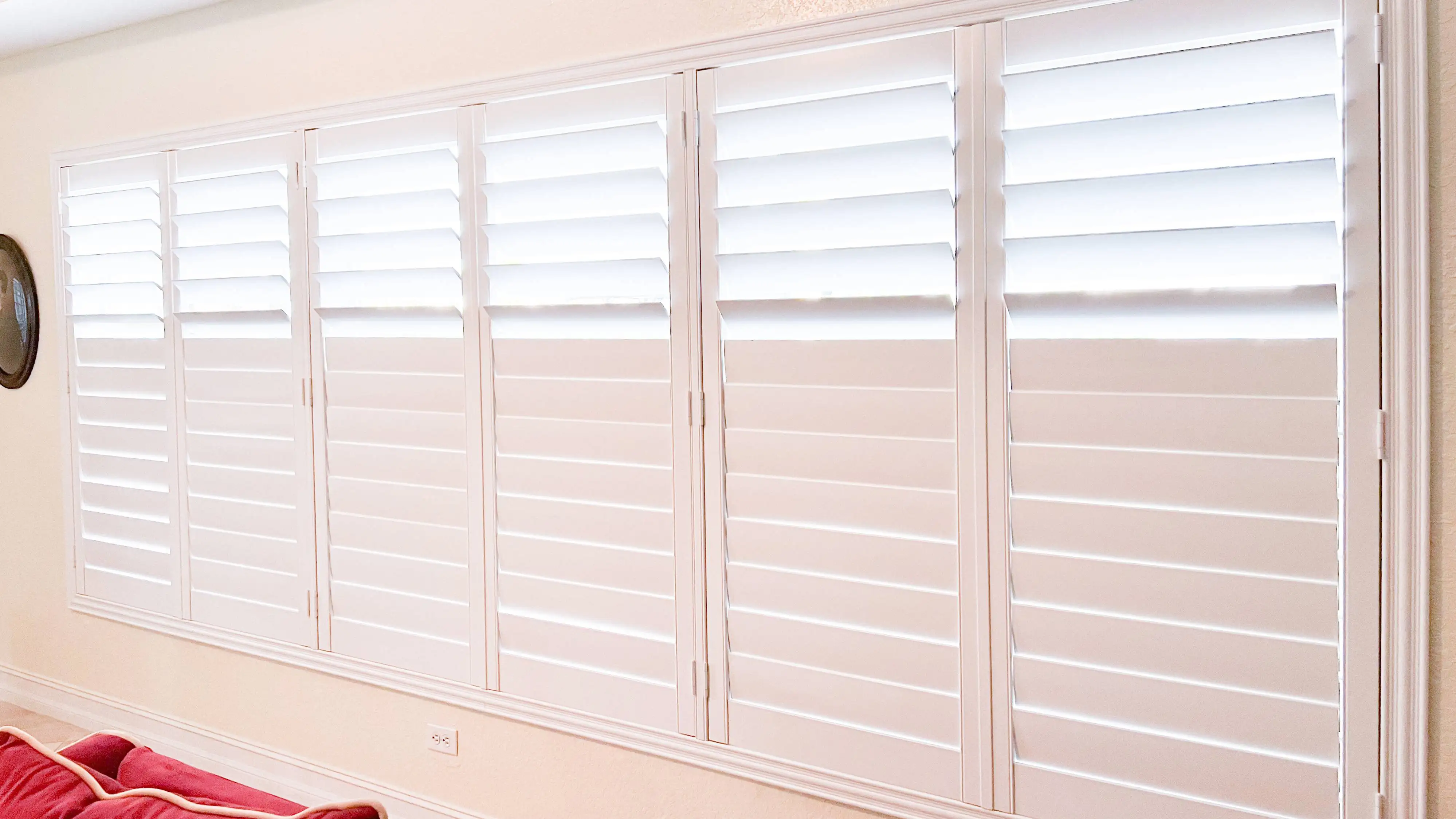 Plantation Shutters for large windows in living room in Pelican Bay