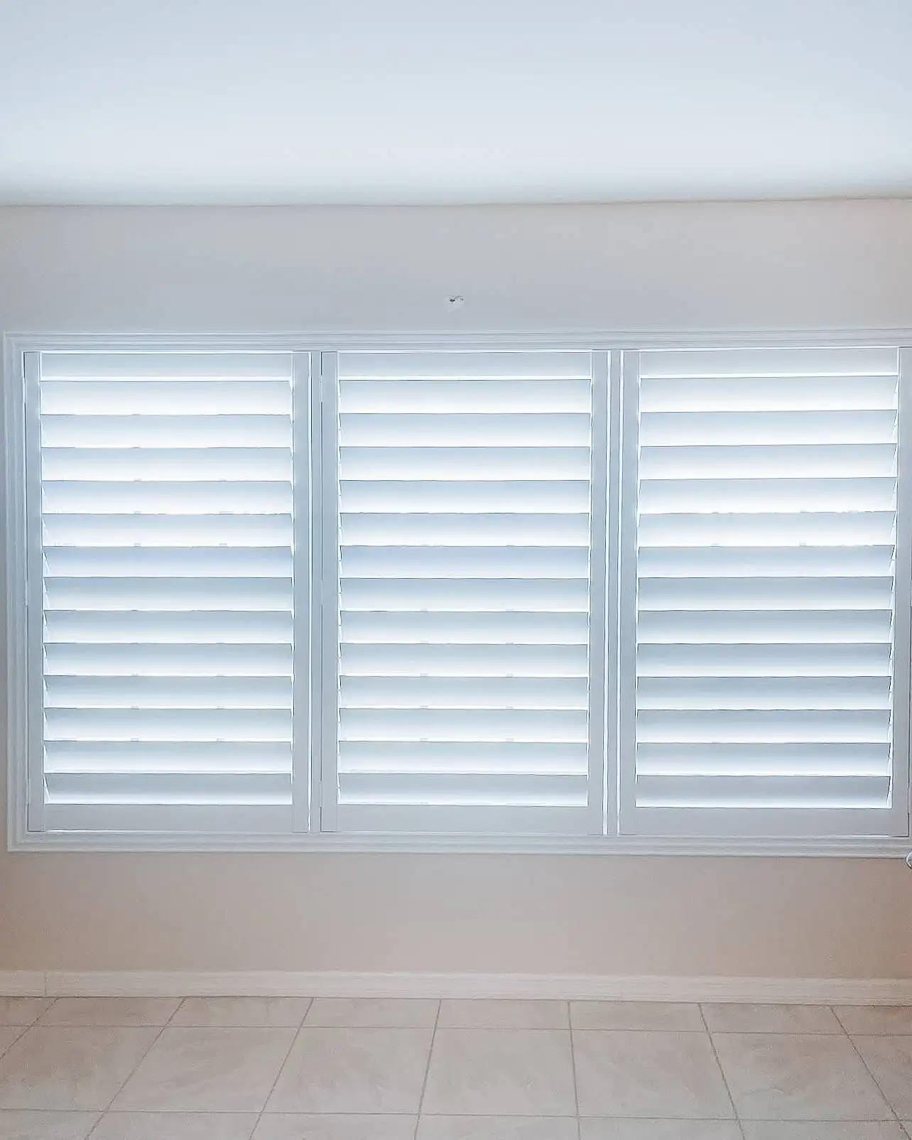 Plantation Shutters for large windows in living room in Punta Gorda