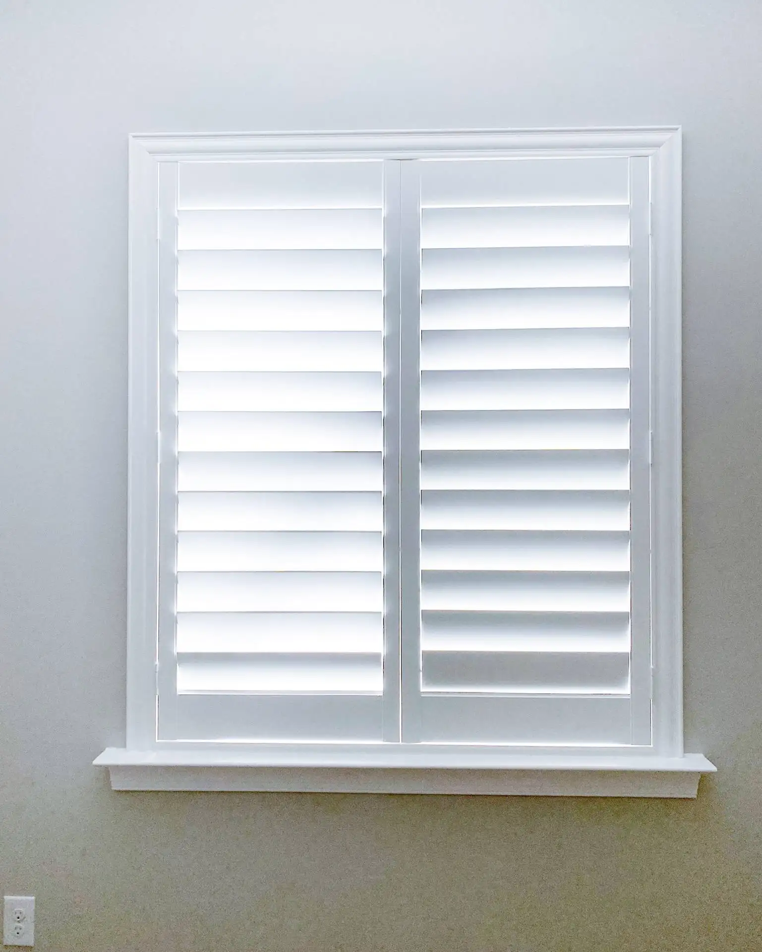 Plantation Shutters for Sidelight Window in living room in Fort Myers
