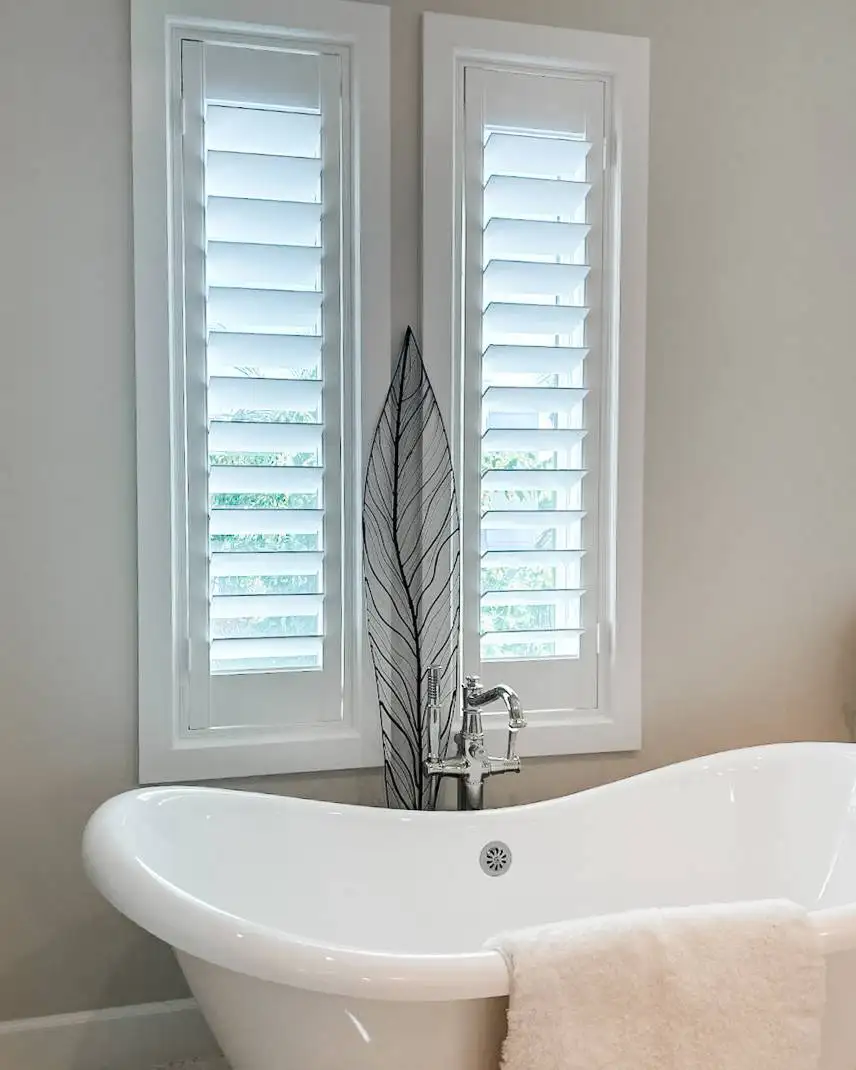 Plantation Shutters for tall window blinds in bathrooms in Naples