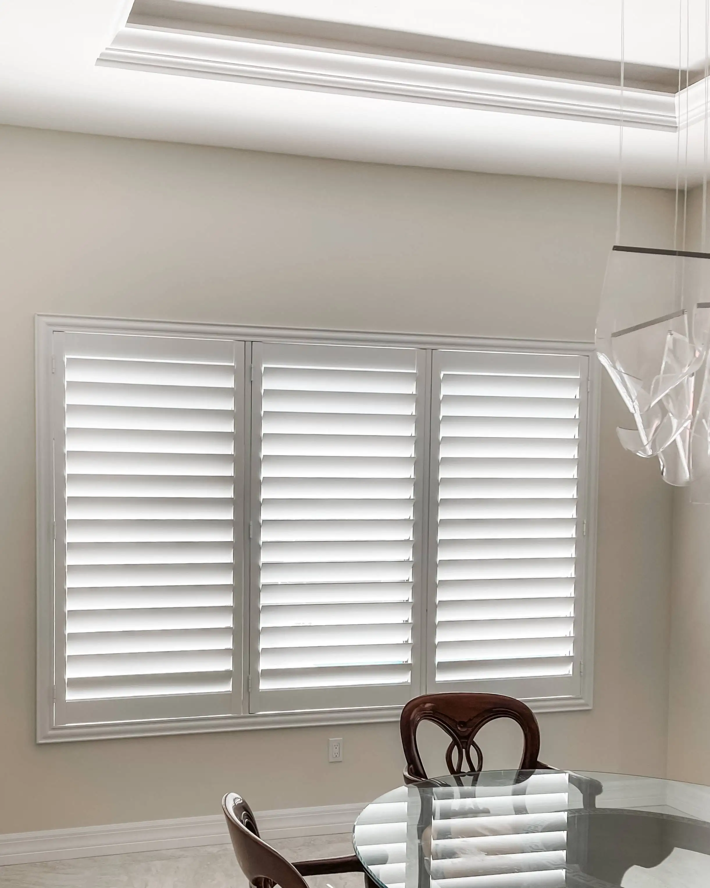 Plantation Shutters | tall window blinds | dining room | Estero Plantation Shutters for tall window blinds in dining room in Estero