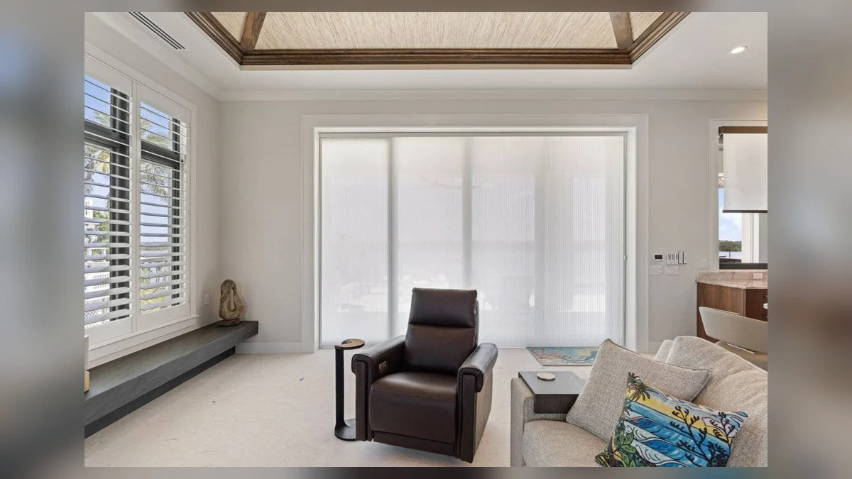 Privacy sheer blinds coordinating with a refined coastal room