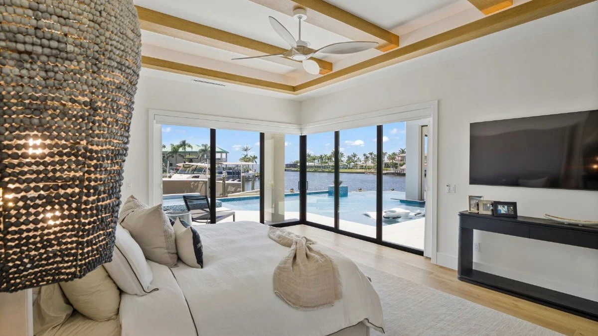 Honeycomb shades open to preserve a Punta Gorda waterfront view