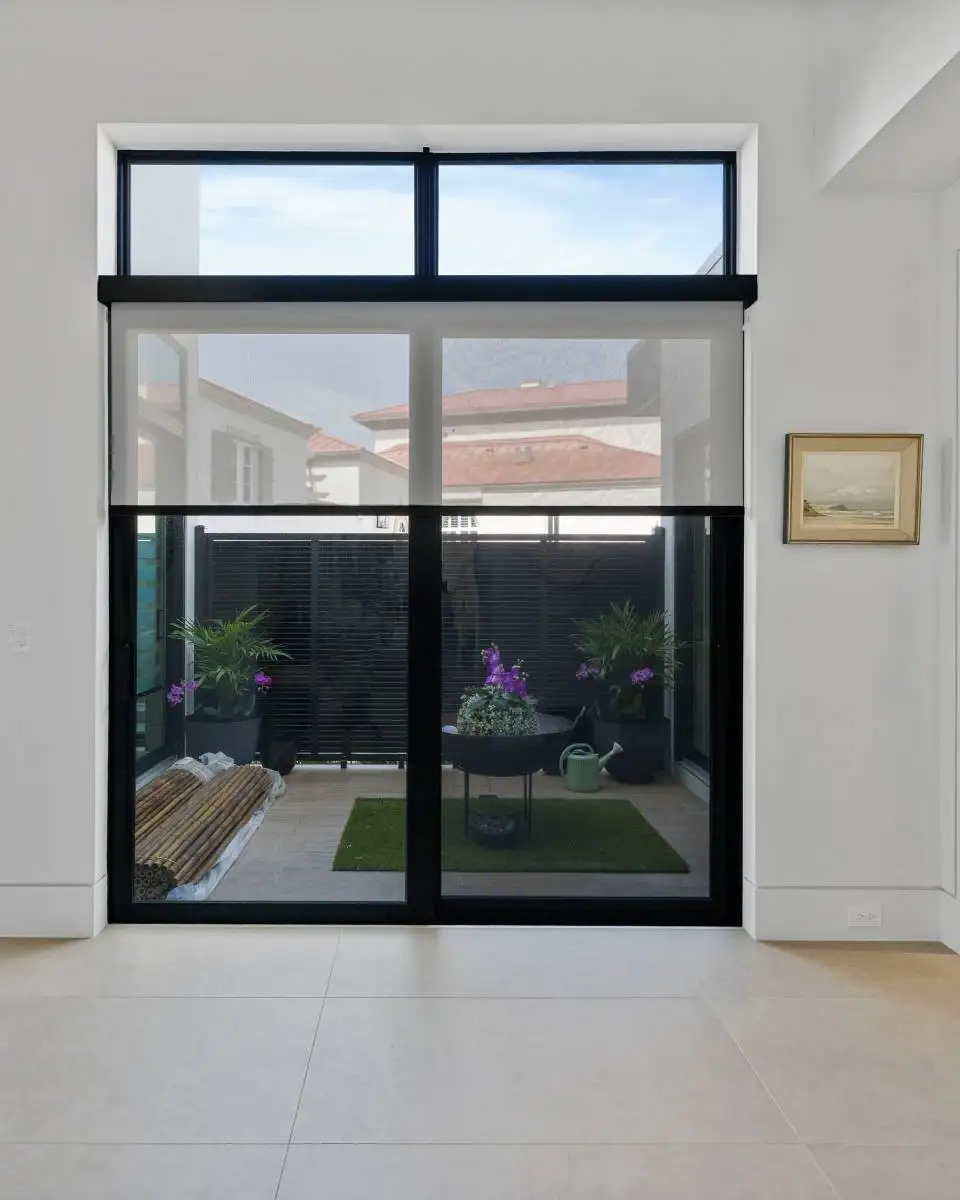 ransform your patio doors into a statement of style and function. Our custom solutions glide effortlessly across oversized openings, delivering smooth operation, whisper-quiet performance, and precise light control. Choose from sheer-to-blackout options, voice-command convenience, and scheduled settings—bringing indoor comfort and outdoor views into perfect balance. Learn more.