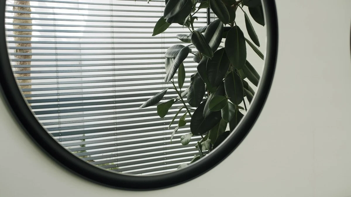 Wide horizontal blinds balancing outdoor views and interior privacy