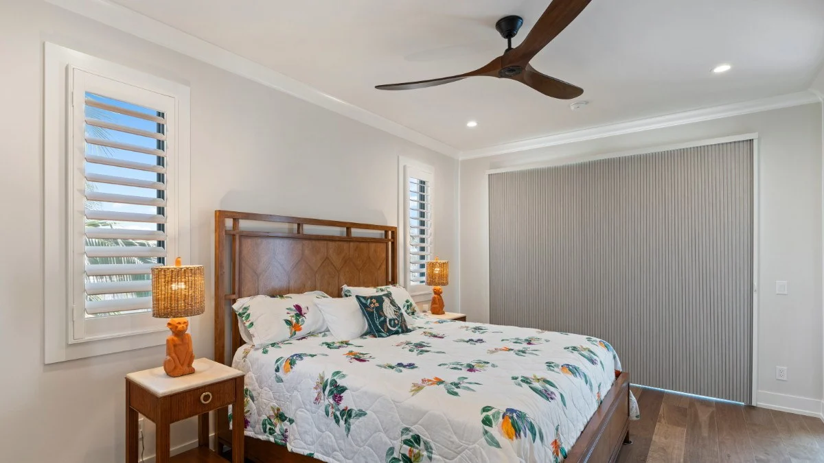 Blackout cellular shades closed in a waterfront bedroom