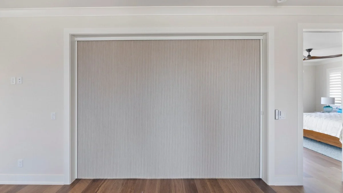 Room-darkening shades fitted across a Southwest Florida waterfront slider