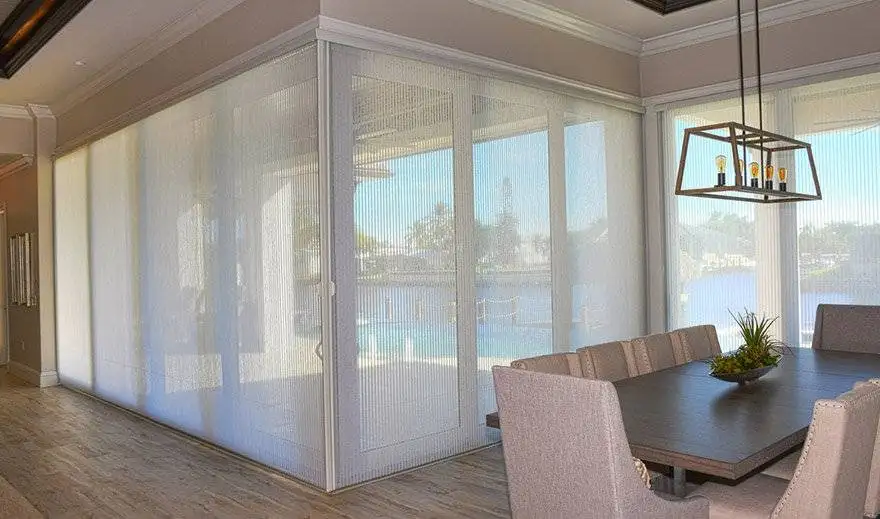 Light-filtering vertical shades across corner sliding glass doors