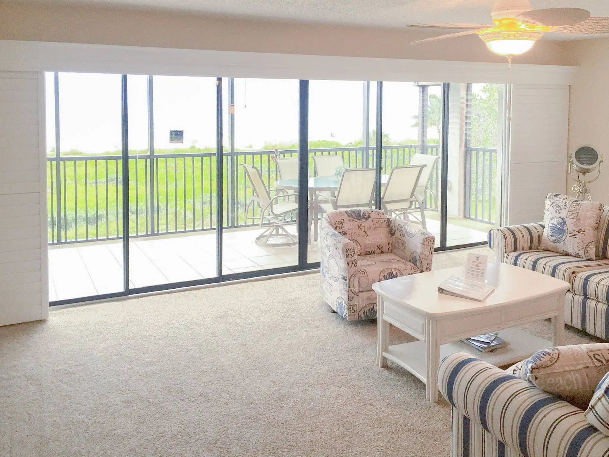 Sliding Shutters | large windows | living room | Estero Sliding Shutters for large windows in living room in Estero