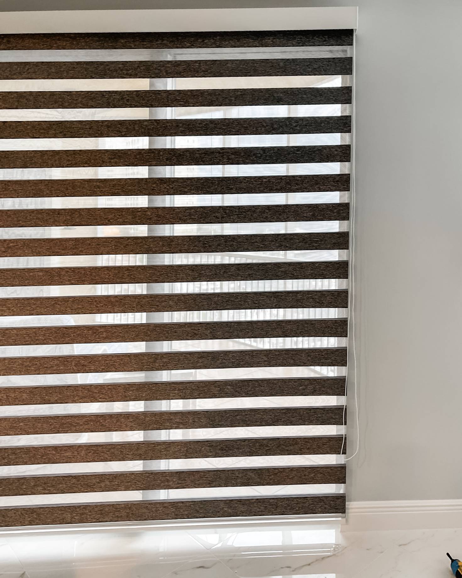 Zebra Shades for sliding doors in dining room in Estero